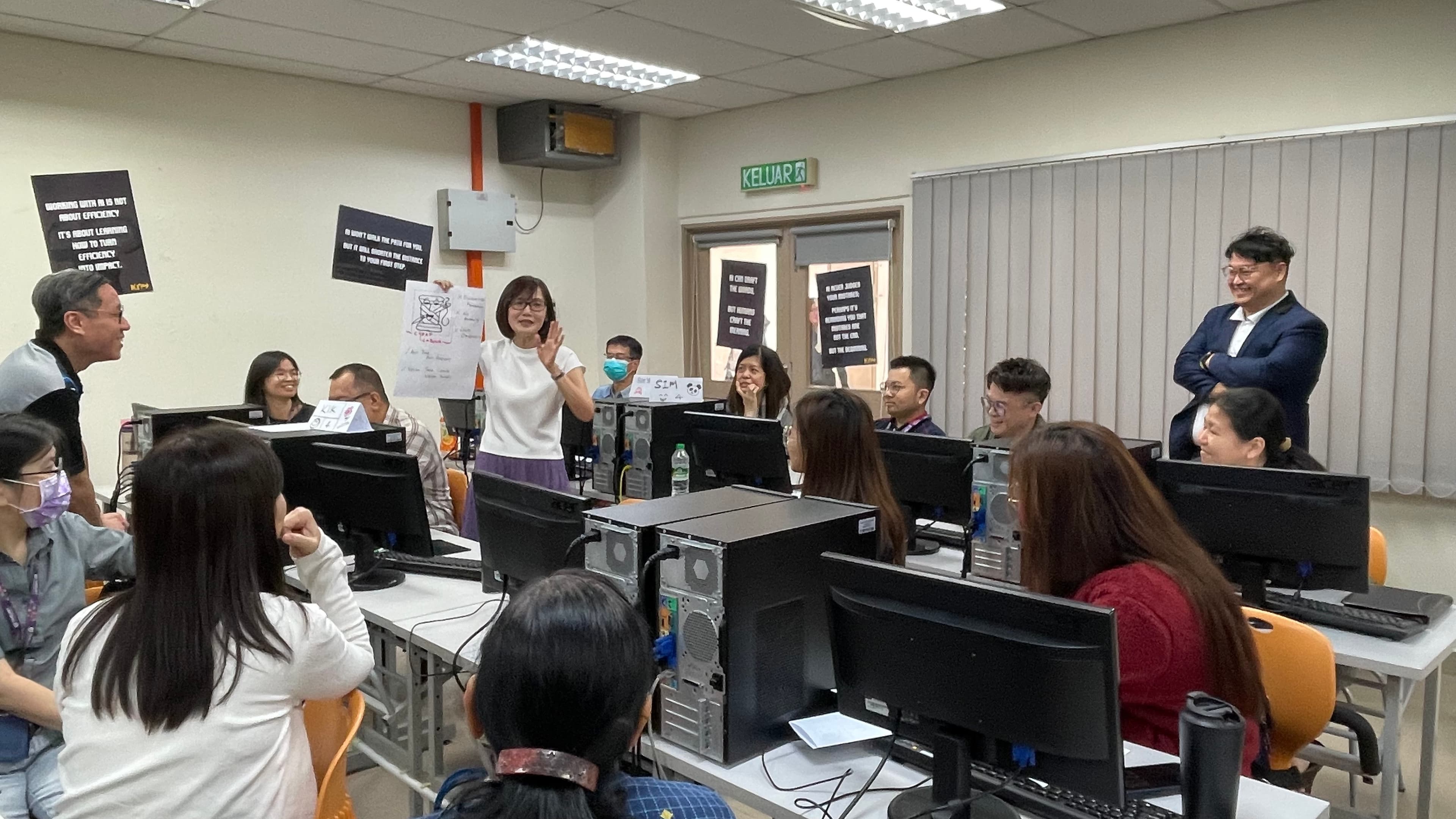 AI training workshop with computers and participants